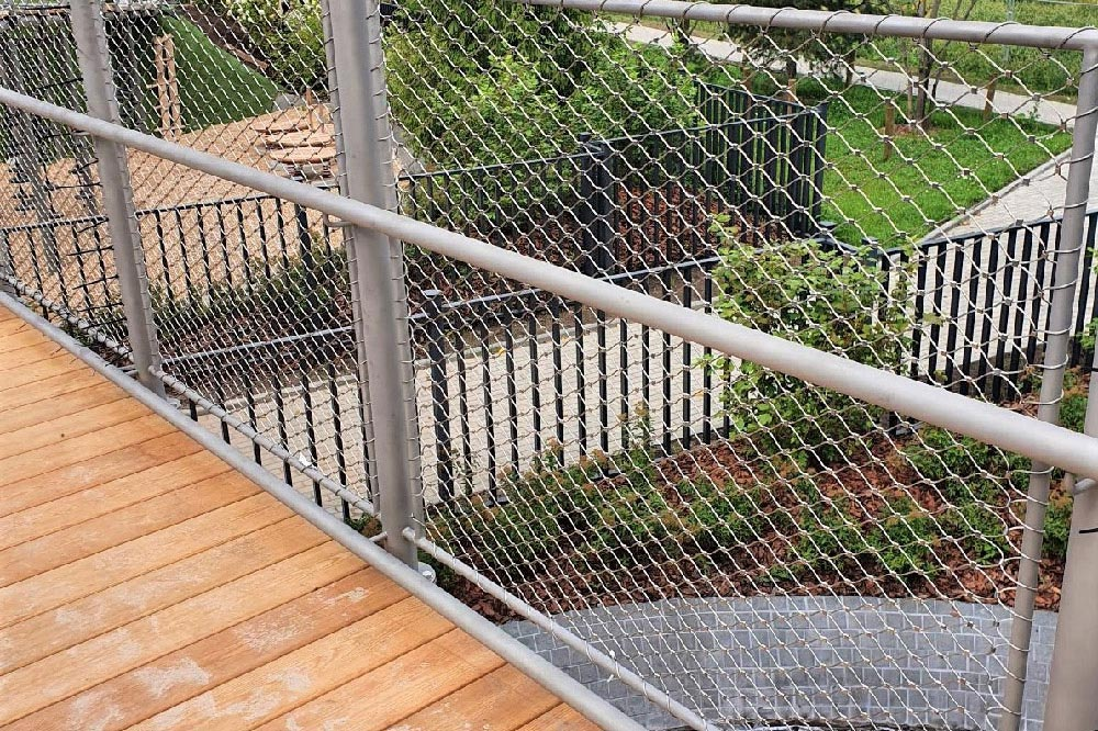 Wide shot timber walkway full length stainless mesh balustrade both sides