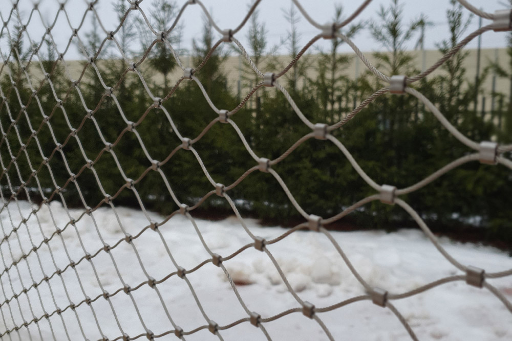 Panoramic timber walkway mesh balustrade snowy park full view