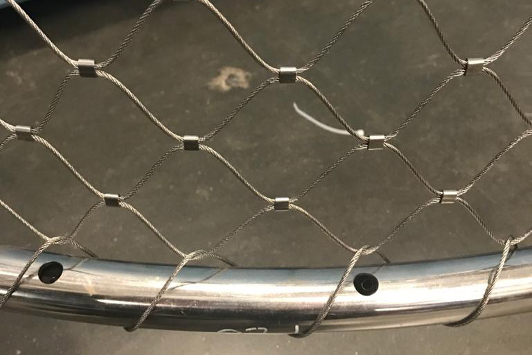 Extreme close-up uniform aluminum ferrule diamond mesh weave