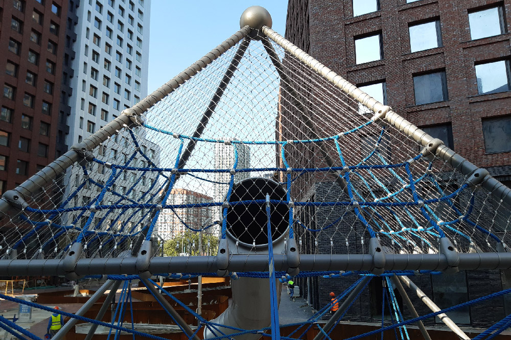 Front full view of pyramid mesh tower during construction stage