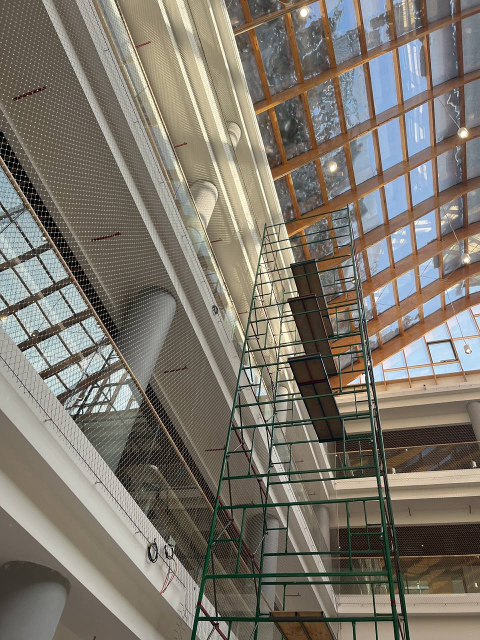 Mall glass skylight atrium construction stage anti‑fall rope mesh